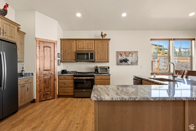 1428 N Broad Hollow Rd, Garden City, UT 84028 - kitchen with light wood-style flooring, a sink, recessed lighting, and appliances with stainless steel finishes