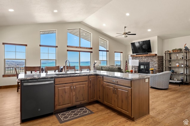 1428 N Broad Hollow Rd, Garden City, UT 84028 - kitchen with light stone counters, a sink, ceiling fan, a fireplace, and dishwashing machine