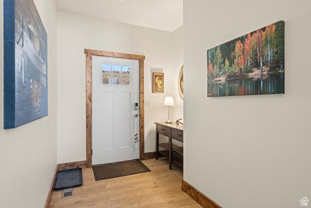 1428 N Broad Hollow Rd, Garden City, UT 84028 - entryway featuring baseboards, wood finished floors, and visible vents