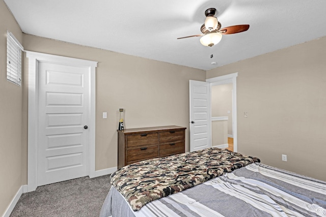 bedroom featuring a ceiling fan, baseboards, and light colored carpet