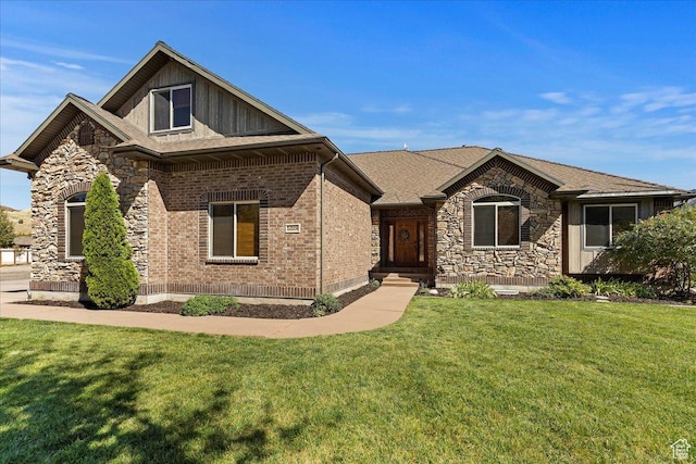 5328 N 3275 E, Liberty, UT 84310 - view of front of home featuring roof with shingles, stone siding, and a front yard