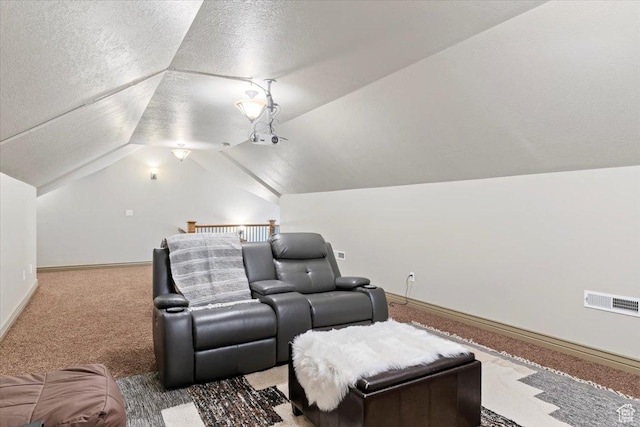 5328 N 3275 E, Liberty, UT 84310 - home theater featuring vaulted ceiling, a textured ceiling, carpet floors, baseboards, and visible vents