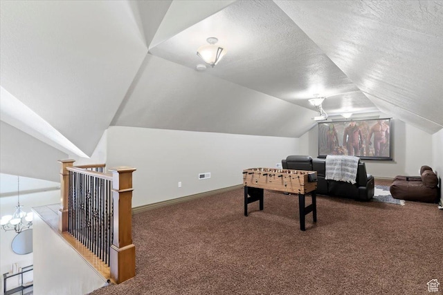 5328 N 3275 E, Liberty, UT 84310 - recreation room featuring carpet flooring, a textured ceiling, vaulted ceiling, visible vents, and baseboards