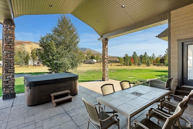 5328 N 3275 E, Liberty, UT 84310 - view of patio / terrace with outdoor dining area, a hot tub, and a mountain view