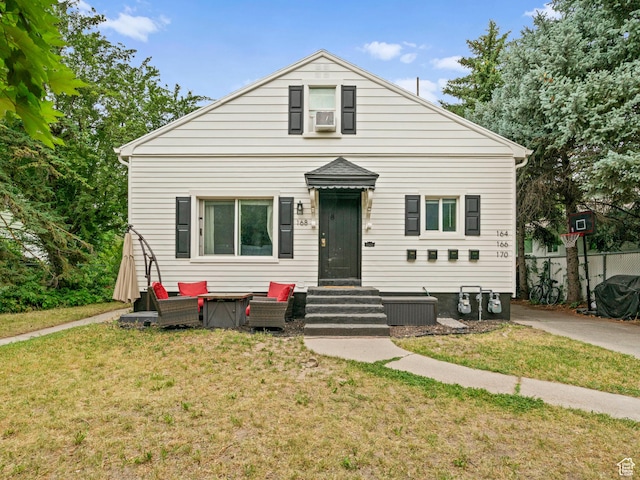 bungalow-style house with entry steps and a front yard