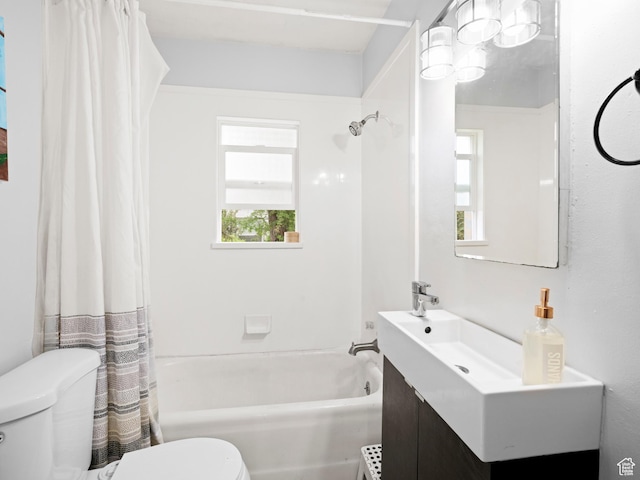 full bath with shower / bath combo with shower curtain, toilet, and vanity