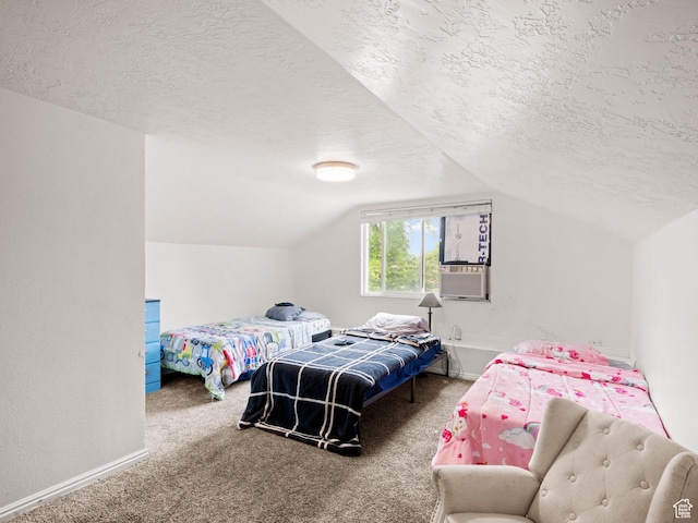 bedroom with vaulted ceiling, a textured ceiling, and carpet flooring
