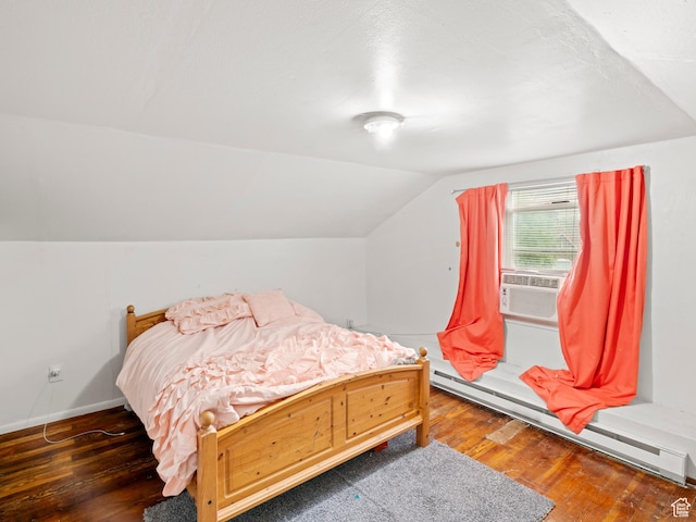 bedroom featuring vaulted ceiling, a baseboard heating unit, cooling unit, wood-type flooring, and baseboards