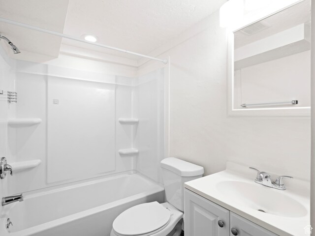 full bath featuring toilet, vanity, visible vents, and bathing tub / shower combination
