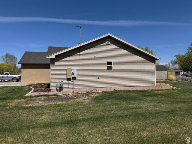532 N 300 E, Roosevelt, UT 84066 - view of side of property with a lawn and roof with shingles