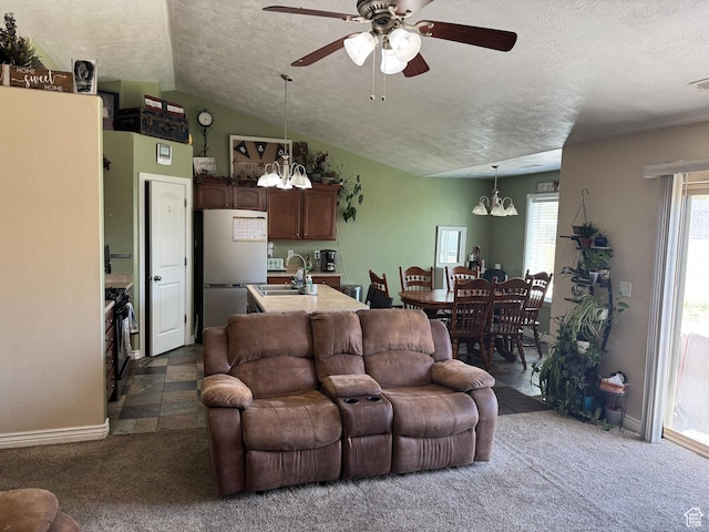 532 N 300 E, Roosevelt, UT 84066 - living room featuring baseboards, dark colored carpet, a textured ceiling, and ceiling fan with notable chandelier