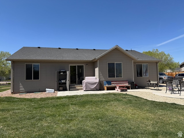 532 N 300 E, Roosevelt, UT 84066 - back of property featuring a shingled roof, a yard, and a patio