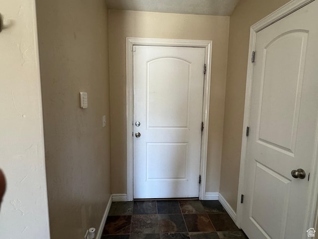 532 N 300 E, Roosevelt, UT 84066 - doorway featuring stone finish floor and baseboards