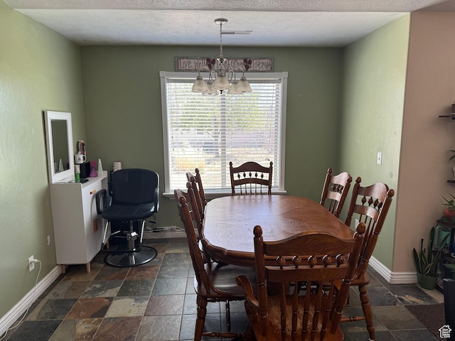 532 N 300 E, Roosevelt, UT 84066 - dining area with stone tile floors, baseboards, a notable chandelier, and visible vents