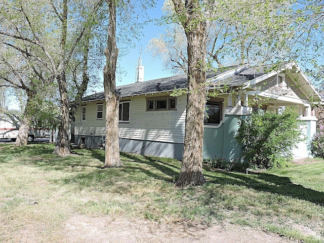 view of home's exterior featuring a yard