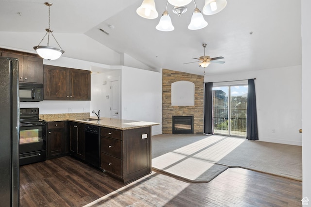 1045 S 1700 W Unit 1032, Payson, UT 84651 - kitchen featuring dark brown cabinets, a sink, black appliances, open floor plan, and a fireplace