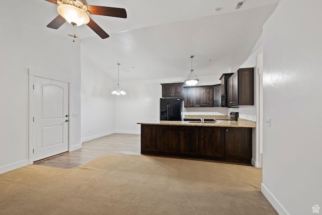 1045 S 1700 W Unit 1032, Payson, UT 84651 - kitchen with dark brown cabinets, baseboards, light colored carpet, and black appliances