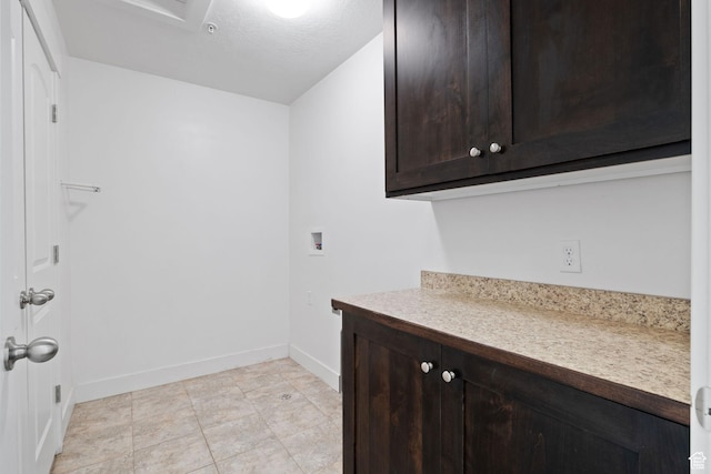 1045 S 1700 W Unit 1032, Payson, UT 84651 - clothes washing area with baseboards, cabinet space, hookup for a washing machine, and light tile patterned flooring