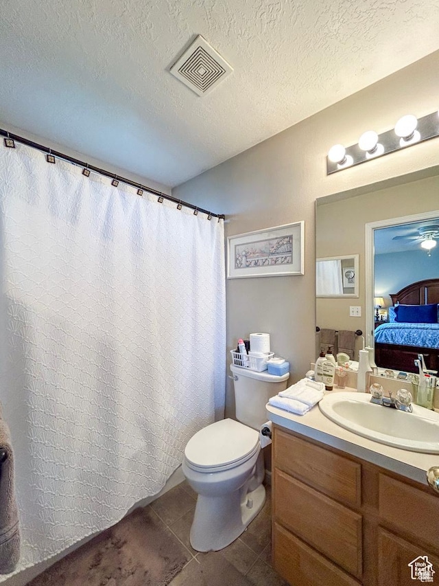 full bath featuring ensuite bathroom, vanity, toilet, tile patterned flooring, and visible vents