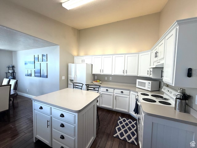 909 E 1520 N, American Fork, UT 84003 - kitchen featuring white appliances, dark wood-style flooring, a center island, and light countertops
