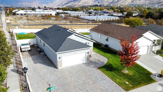 drone / aerial view with a mountain view and a residential view