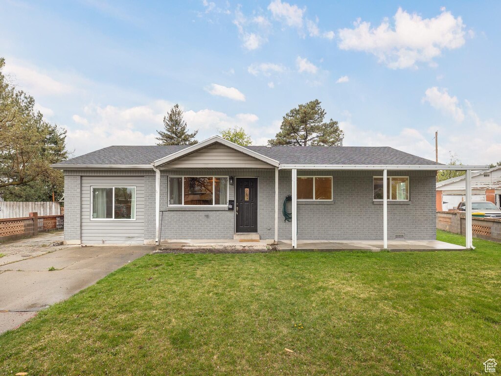 311 E 1830 S, Orem, UT 84058 - ranch-style home with brick siding, a front yard, and fence