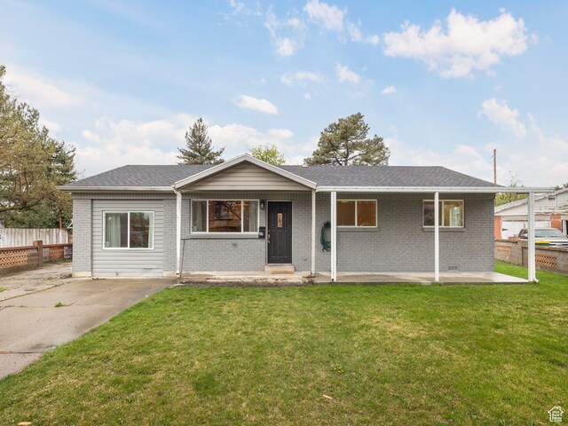 311 E 1830 S, Orem, UT 84058 - ranch-style home with brick siding, a front yard, and fence