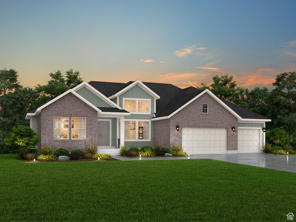 238 W 3175 N, Pleasant View, UT 84414 - view of front of home featuring brick siding, an attached garage, a lawn, and driveway