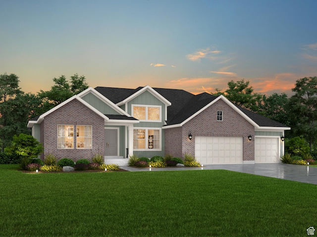 view of front of home featuring brick siding, an attached garage, a lawn, and driveway