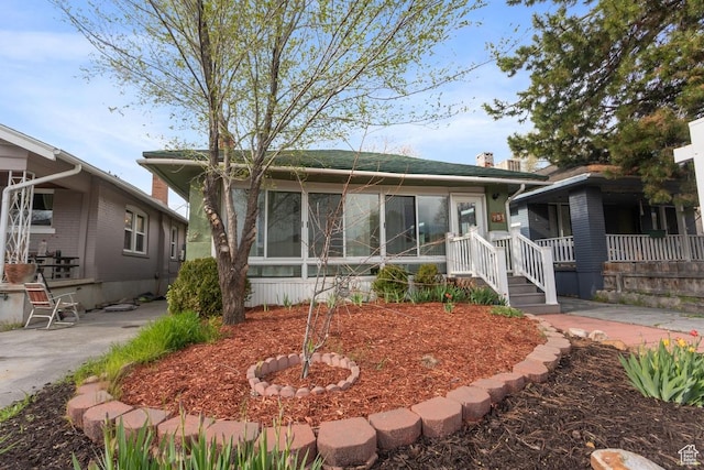 751 E Browning Ave S, Salt Lake City, UT 84105 - bungalow-style home featuring a sunroom