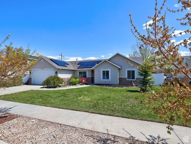 single story home with roof mounted solar panels, a front lawn, stucco siding, stone siding, and a garage