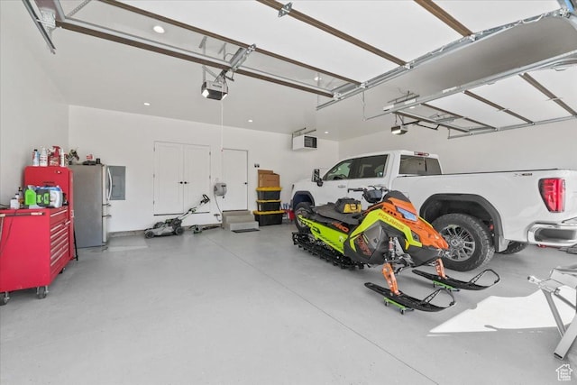 733 E 750 S, Preston, ID 83263 - garage featuring recessed lighting, freestanding refrigerator, and a garage door opener