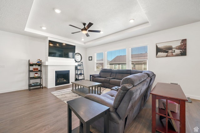 788 N 2100 E, Spanish Fork, UT 84660 - living area with a ceiling fan, a tray ceiling, baseboards, and a textured ceiling