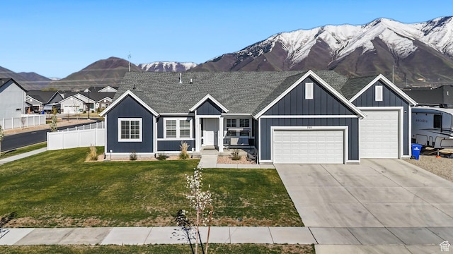 788 N 2100 E, Spanish Fork, UT 84660 - view of front of property featuring concrete driveway, an attached garage, fence, and a mountain view