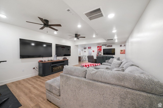 788 N 2100 E, Spanish Fork, UT 84660 - living room with visible vents, a ceiling fan, light wood-style flooring, and baseboards