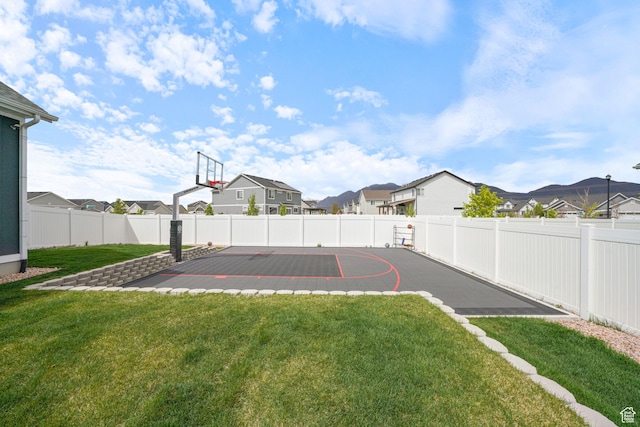 788 N 2100 E, Spanish Fork, UT 84660 - view of sport court featuring a residential view, basketball court, a lawn, and a fenced backyard