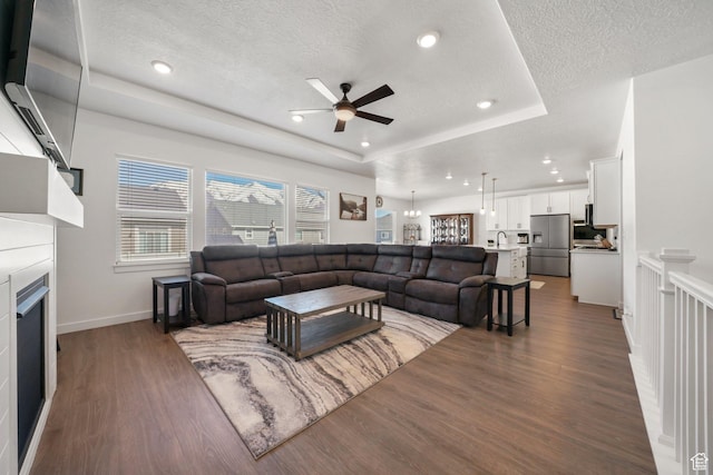 788 N 2100 E, Spanish Fork, UT 84660 - living area featuring a textured ceiling, dark wood-style flooring, ceiling fan, and a fireplace