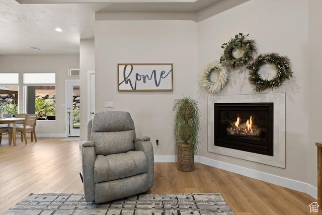 1920 W 180 N, Hurricane, UT 84737 - sitting room featuring a tiled fireplace, wood finished floors, and baseboards