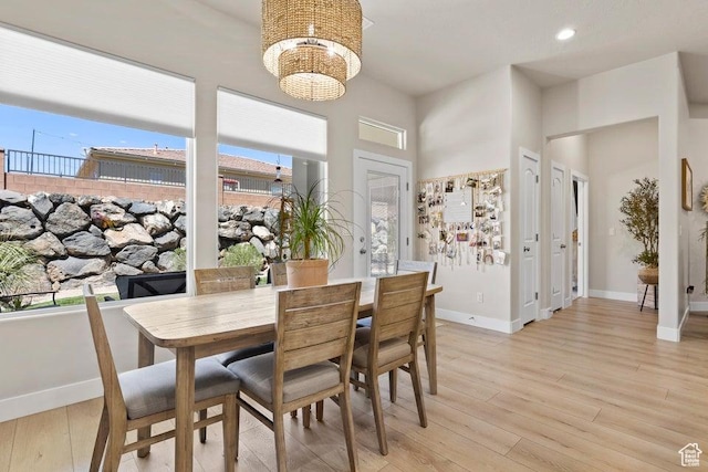 1920 W 180 N, Hurricane, UT 84737 - dining area featuring a healthy amount of sunlight, light wood finished floors, baseboards, and an inviting chandelier