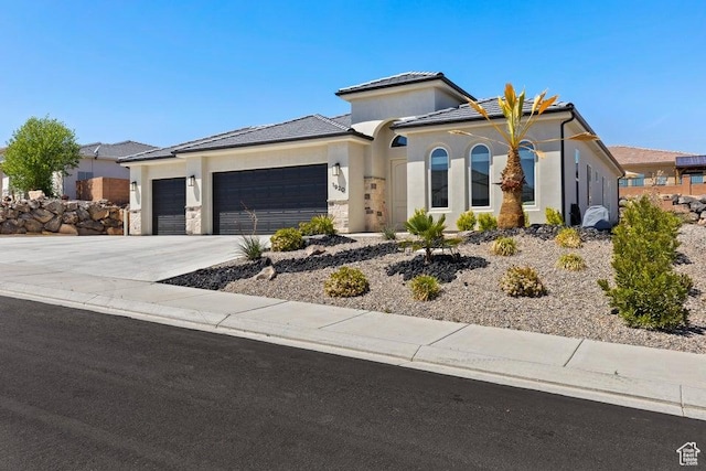 1920 W 180 N, Hurricane, UT 84737 - view of front of property featuring an attached garage, a tiled roof, driveway, and stucco siding