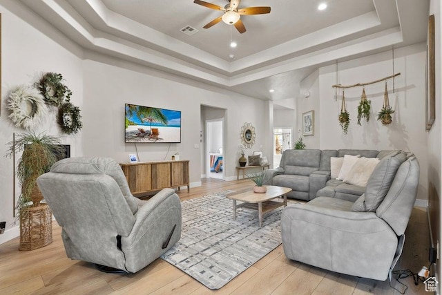 1920 W 180 N, Hurricane, UT 84737 - living room featuring baseboards, visible vents, light wood-style floors, a ceiling fan, and a raised ceiling