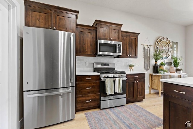 1920 W 180 N, Hurricane, UT 84737 - kitchen with light countertops, light wood-style floors, and appliances with stainless steel finishes