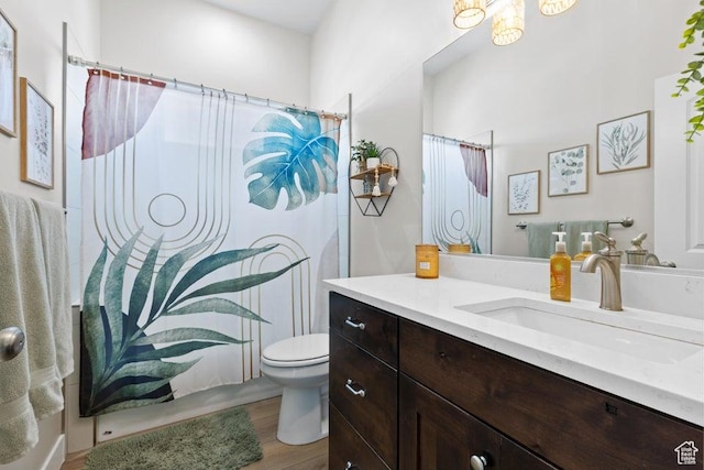 1920 W 180 N, Hurricane, UT 84737 - full bathroom with a shower with shower curtain, wood finished floors, toilet, and vanity