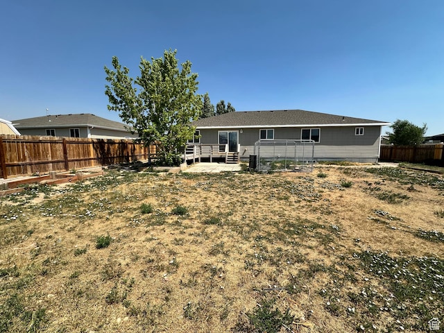 1373 W 925 S, Vernal, UT 84078 - rear view of house with a wooden deck and a fenced backyard