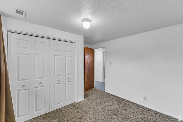 3788 W Hillsboro Cir, West Jordan, UT 84084 - unfurnished bedroom with a textured ceiling, a closet, carpet, baseboards, and visible vents