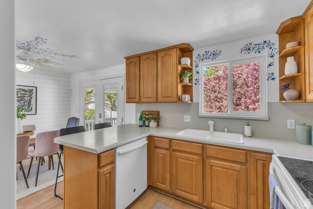 3788 W Hillsboro Cir, West Jordan, UT 84084 - kitchen featuring open shelves, a peninsula, a sink, and white appliances