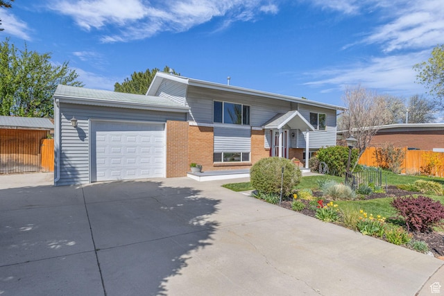 3788 W Hillsboro Cir, West Jordan, UT 84084 - bi-level home featuring an attached garage, fence, brick siding, and concrete driveway