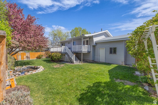 3788 W Hillsboro Cir, West Jordan, UT 84084 - rear view of house with fence, a deck, a yard, and stairway