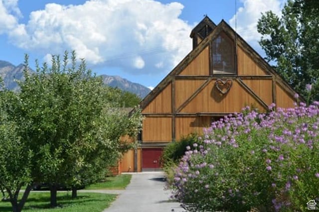 912 W Bellshill Dr Unit 15, Murray, UT 84123 - view of barn featuring a mountain view, asphalt driveway, and an attached garage