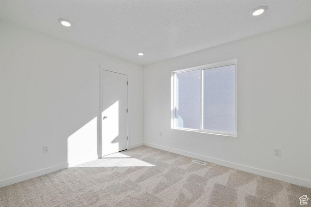 912 W Bellshill Dr Unit 15, Murray, UT 84123 - spare room with baseboards, light carpet, and recessed lighting